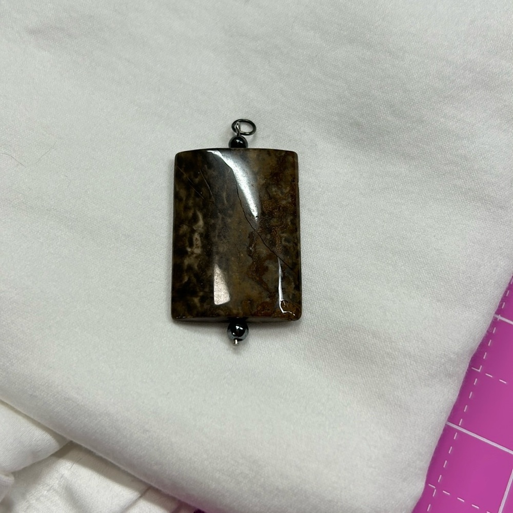 Polished stone pendant
